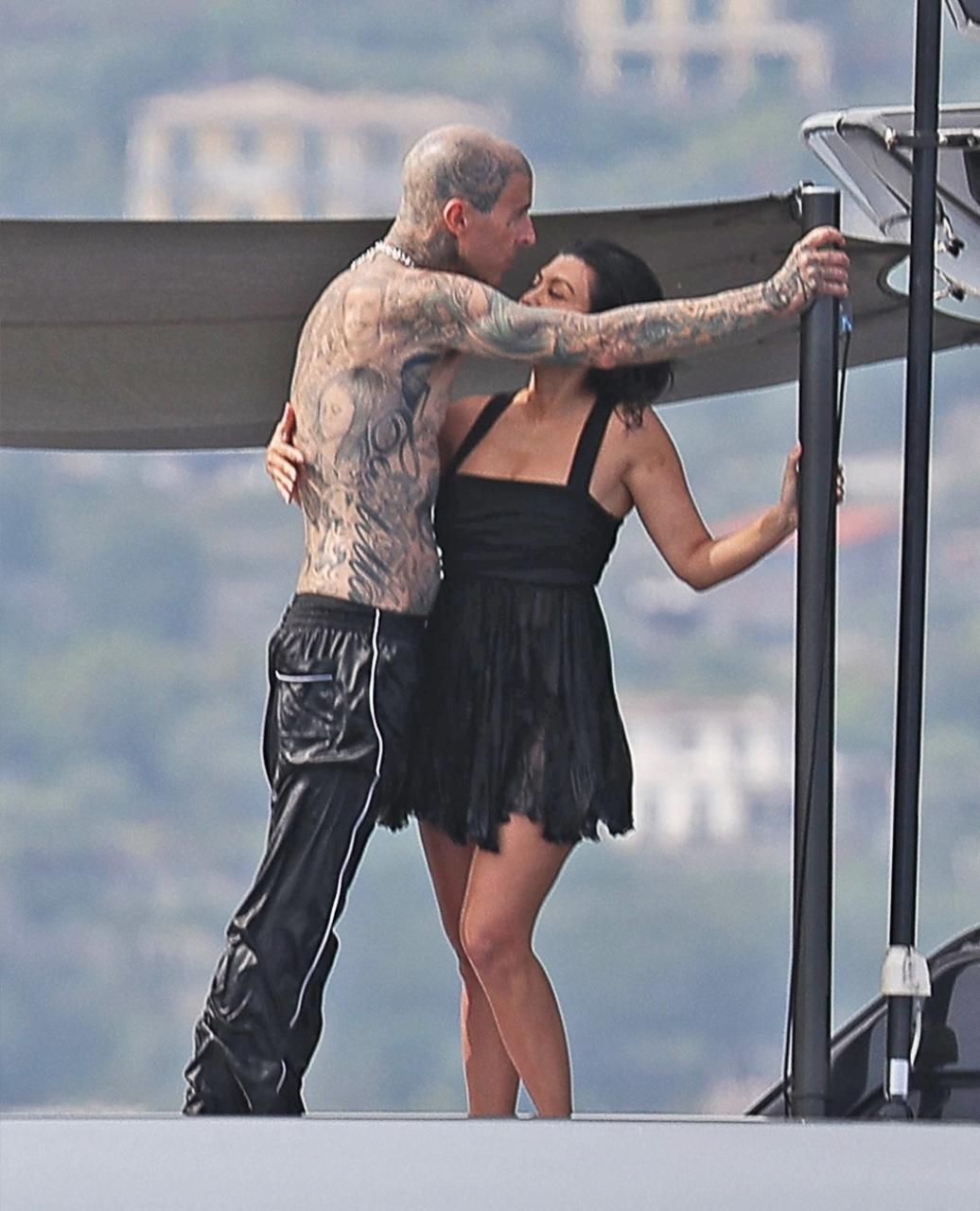 Kourtney Kardashian and Travis Barker enjoy romantic day on luxury yacht as they honeymoon in Italy