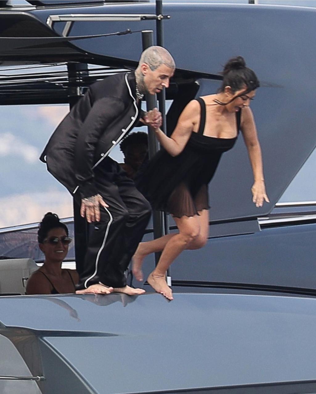 Kourtney Kardashian and Travis Barker enjoy romantic day on luxury yacht as they honeymoon in Italy