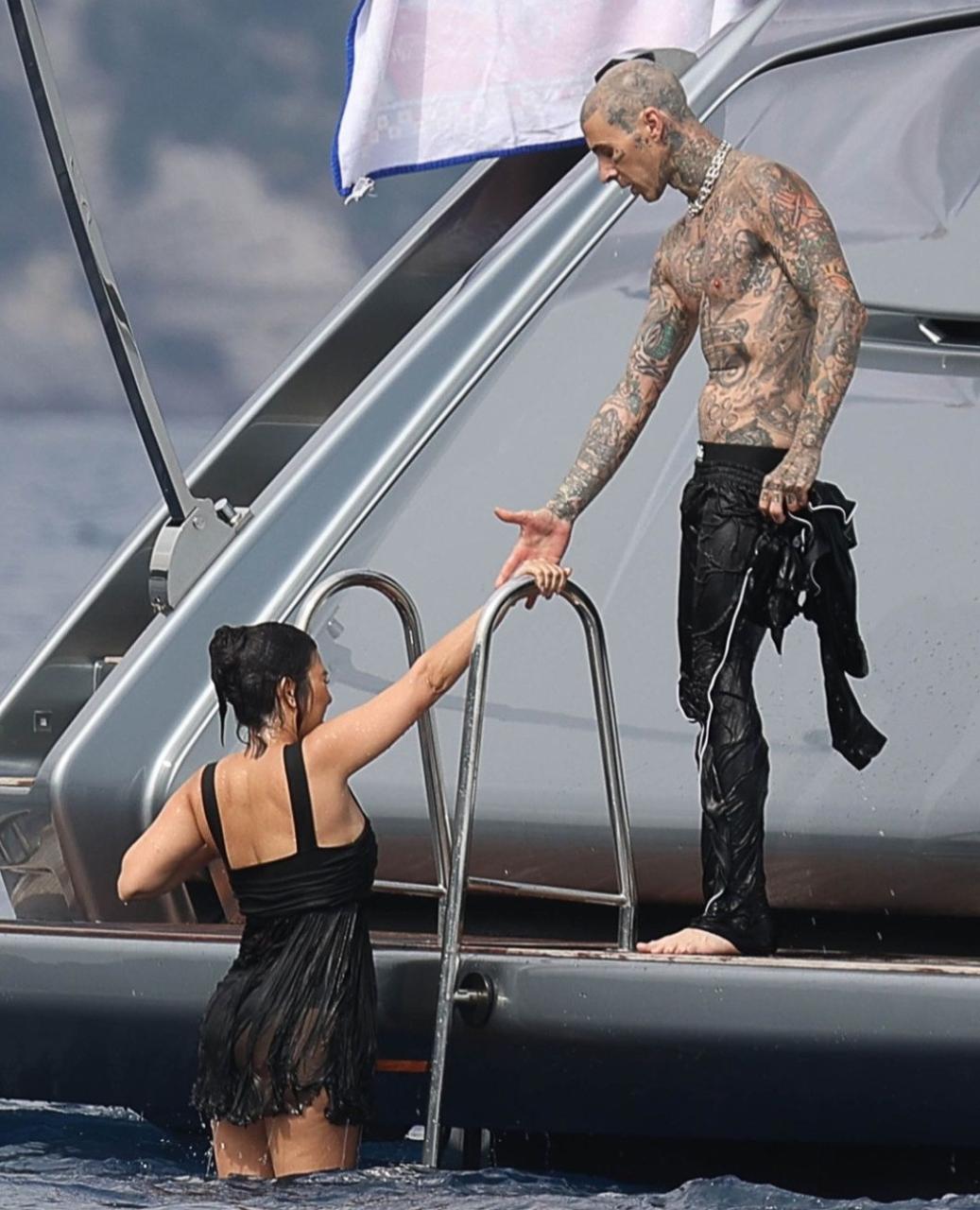 Kourtney Kardashian and Travis Barker enjoy romantic day on luxury yacht as they honeymoon in Italy