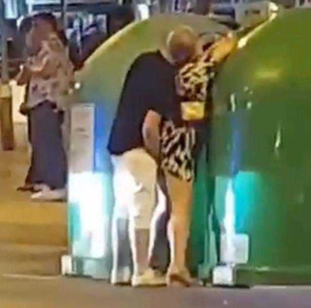 Couple perform sex act against a bin in the presence of shocked tourists before police arrives and flogs them (video)
