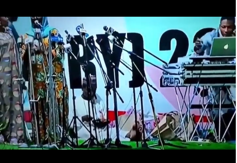 Man captured on camera sitting and eating on the podium while events scheduled for APC?s presidential primary were ongoing (video)