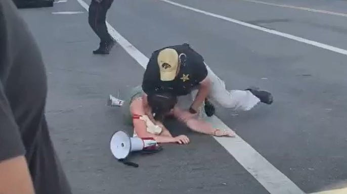 US secret service take down female protester as she approaches Joe Biden