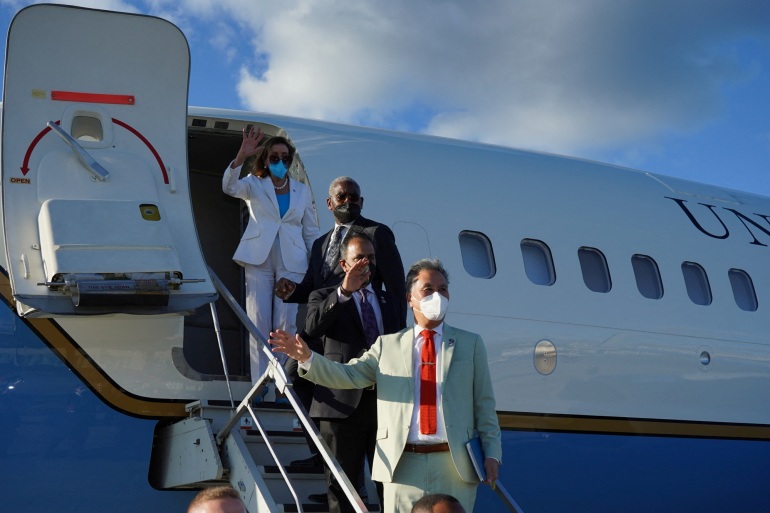 US House of Representatives Speaker Nancy Pelosi and members of her delegation wave as they board a plane in Taipei, Taiwan.