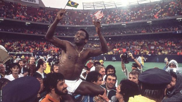 Pele is carried off the pitch by his New York Cosmos team-mates after his final game in 1977