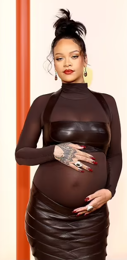 Pregnant Rihanna shows off her baby bump in sheer dress on the Oscars 2023 red carpet (video)