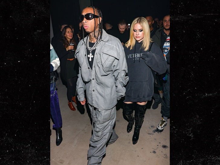 Avril Lavigne and Tyga kiss at Paris fashion week