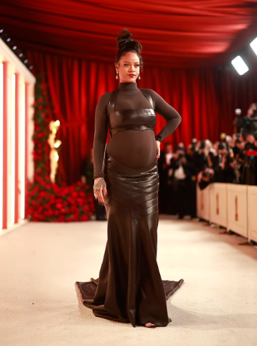Pregnant Rihanna shows off her baby bump in sheer dress on the Oscars 2023 red carpet (video)
