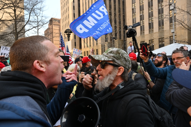 Supporters and critics of Donald Trump face off in New York ahead of the arraignment hearing