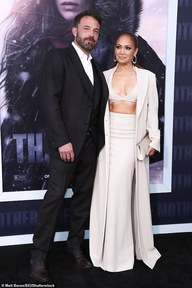 Jennifer Lopez and Ben Affleck share a steamy kiss at the premiere of JLo