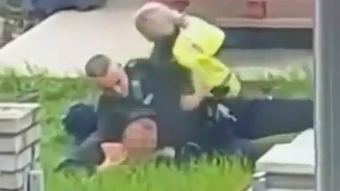 Watch Police officer punch man in the head nine times while restraining him in chokehold (video)