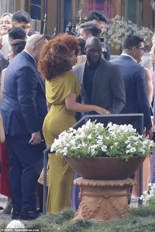 See more photos of Rapper Megan Thee Stallion and football star Romelu Lukaku holding hands at his teammate
