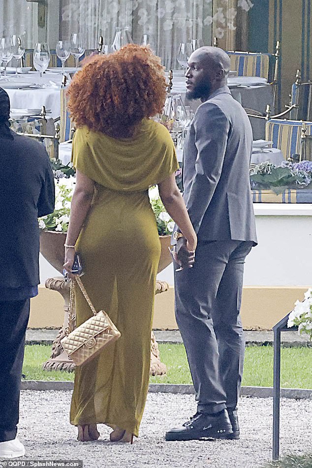 See more photos of Rapper Megan Thee Stallion and football star Romelu Lukaku holding hands at his teammate