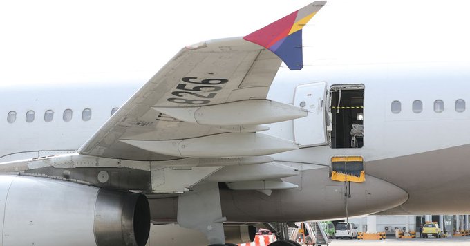 Moment passenger suddenly opens the door of a plane mid-air causing panic amongst passengers and emergency landing (videos)