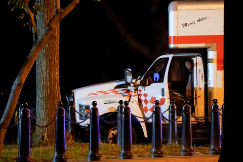 Moment driver crashes truck with Nazi flag inside it next to the White House (video)
