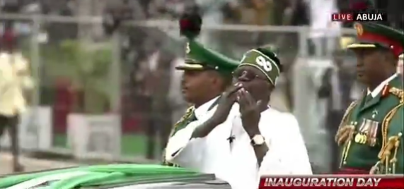 President Bola Tinubu blows Nigerians a kiss as he inspects the parade after his swearing-in (video)