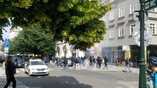 Fans dressed in black attack West Ham supporters in Prague