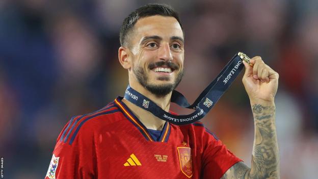 Joselu poses with his medal after winning the Nations League