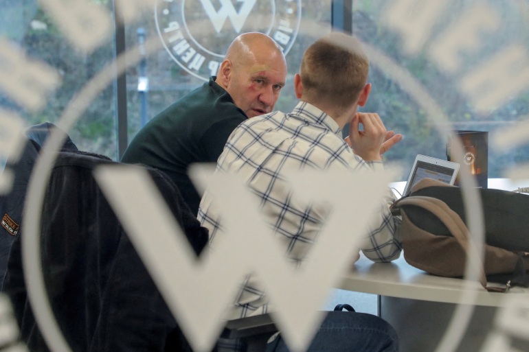 Men speak inside PMC Wagner Centre