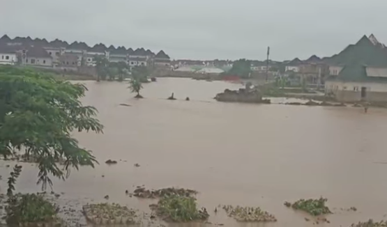 Many trapped in their houses as flood takes over Trade Moore Area of Lugbe in Abuja following many hours of rainfall (video)