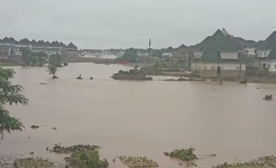 Many trapped in their houses as flood takes over Trade Moore Area of Lugbe in Abuja following many hours of rainfall (video)