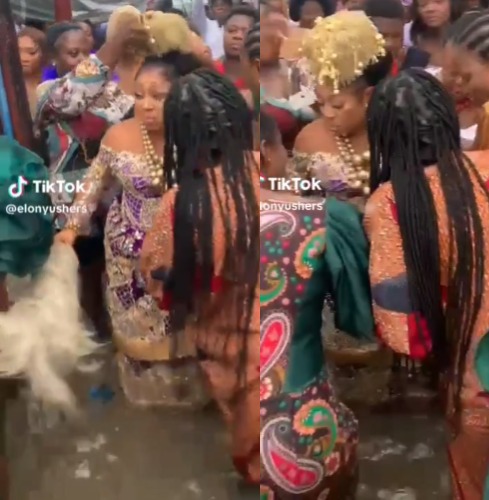 Bride and her friends defy rain to dance at her traditional wedding ceremony (video)