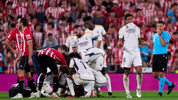 Eder Militao was helped off the pitch with an injury