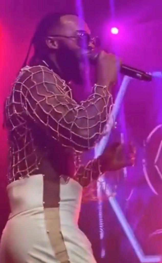Singer, Flavour, causes a stir as he performs on stage in crop top and a unique trouser (video)